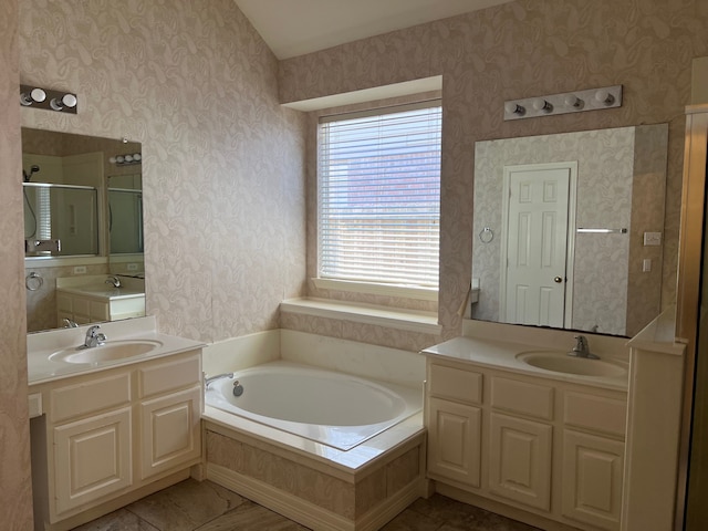 bathroom featuring independent shower and bath and vanity