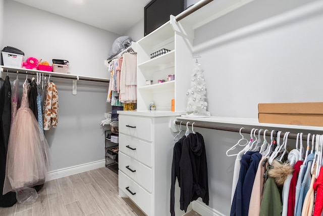 spacious closet featuring light hardwood / wood-style floors