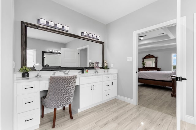 bathroom featuring hardwood / wood-style floors and vanity