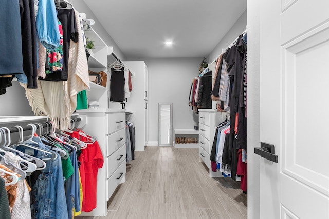 walk in closet featuring light hardwood / wood-style floors