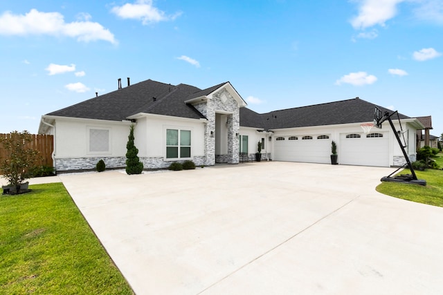 view of front facade featuring a front yard and a garage