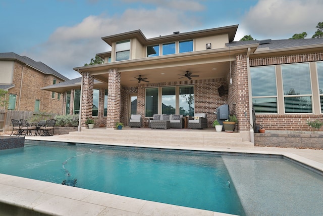 rear view of property featuring an outdoor hangout area, ceiling fan, and a patio area