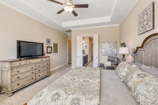 bedroom featuring ceiling fan, a raised ceiling, ornamental molding, and light carpet