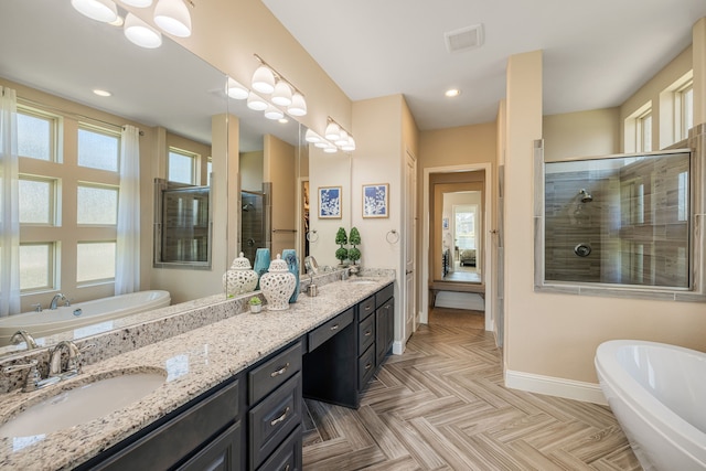 bathroom featuring plus walk in shower and vanity