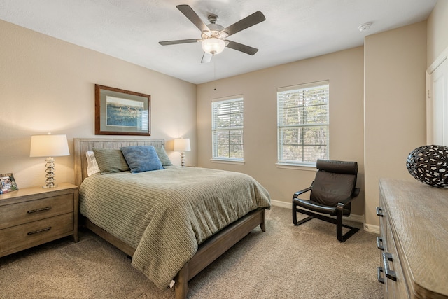 bedroom featuring light carpet and ceiling fan