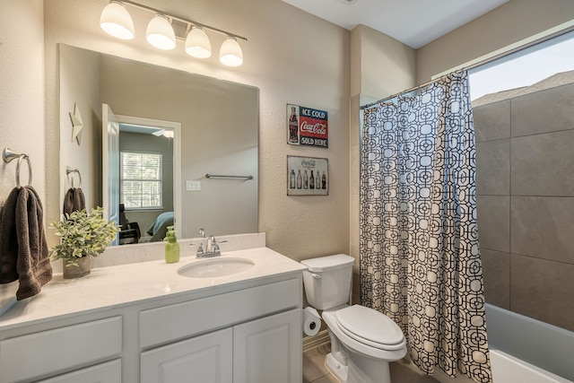 full bathroom with toilet, vanity, shower / tub combo with curtain, and a wealth of natural light