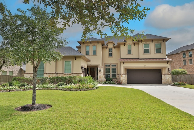 view of front facade with a garage and a front lawn