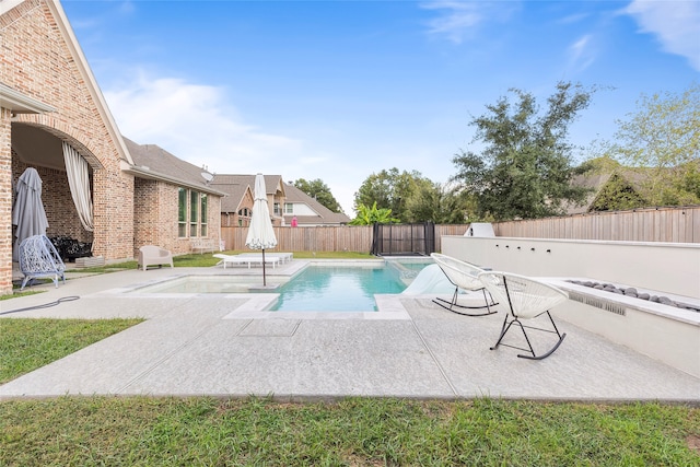 view of swimming pool featuring a patio