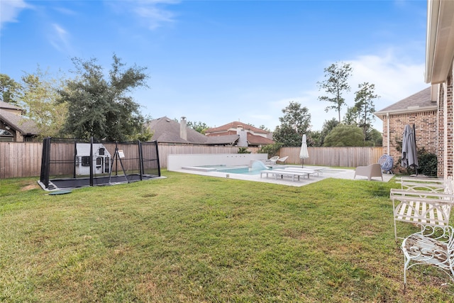 view of yard with a patio area and a fenced in pool