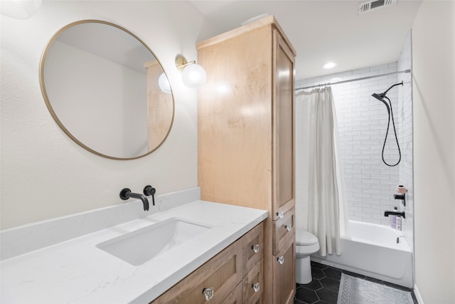 full bathroom featuring toilet, shower / bath combination with curtain, vanity, and tile patterned floors