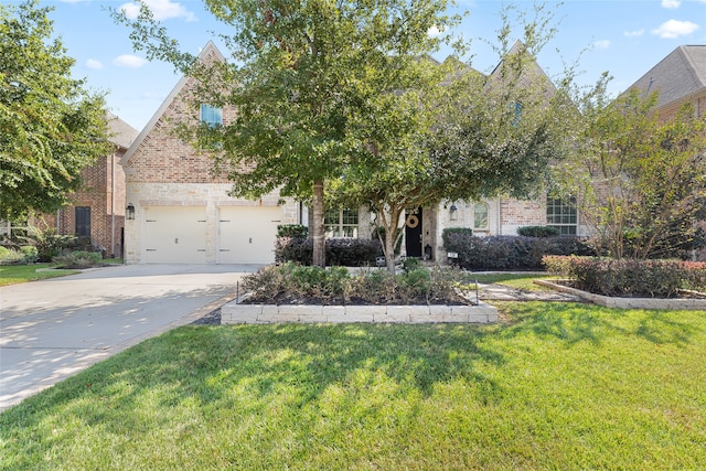 view of front facade featuring a front yard and a garage