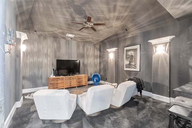 carpeted cinema room featuring ceiling fan and lofted ceiling