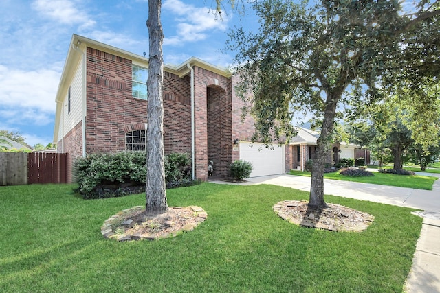 view of front of house with a front yard and a garage