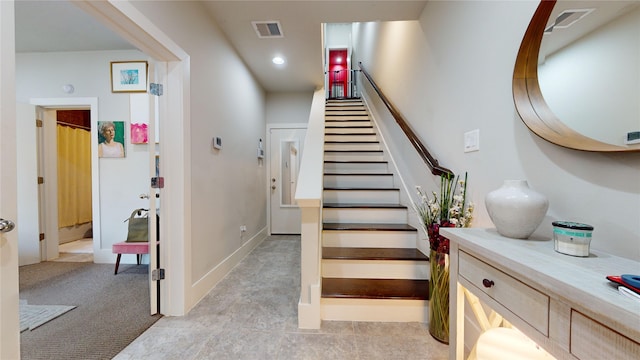 staircase with carpet floors