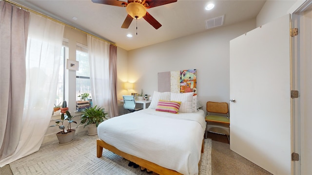 carpeted bedroom with ceiling fan