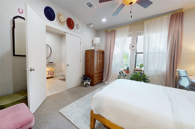 bedroom with ceiling fan and light colored carpet