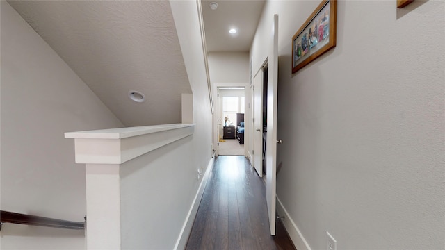 corridor with wood-type flooring