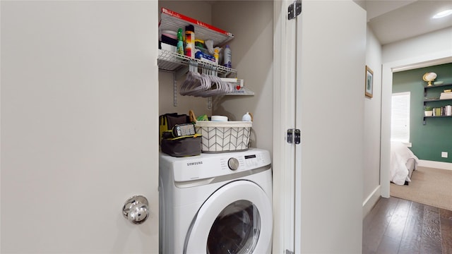 washroom with washer / clothes dryer and dark hardwood / wood-style floors