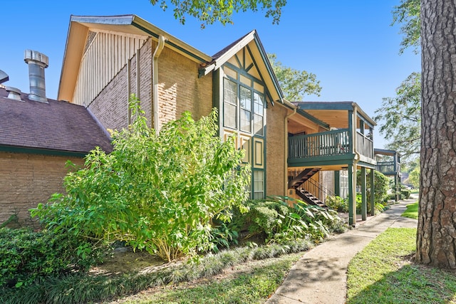 view of side of property featuring a deck