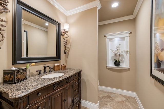 bathroom with crown molding and vanity