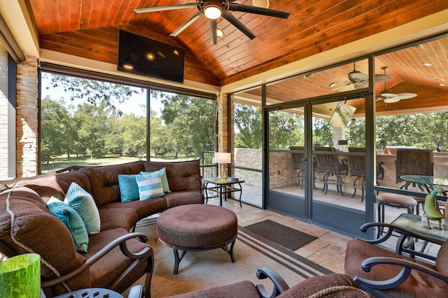 sunroom featuring wooden ceiling, vaulted ceiling, and ceiling fan