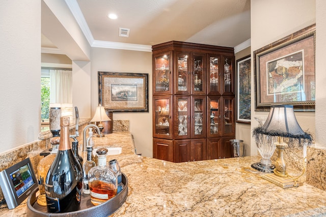 interior space featuring crown molding and sink