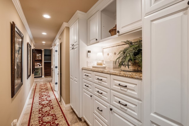 hall featuring ornamental molding