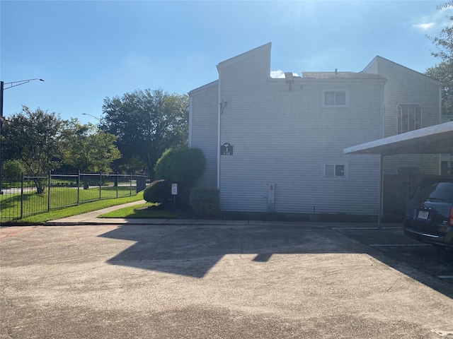 view of property exterior with a yard