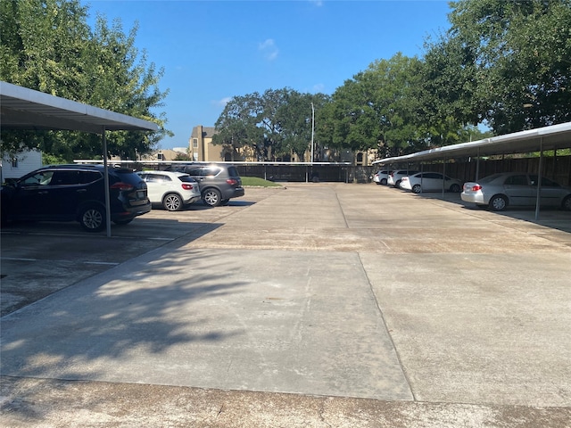 view of vehicle parking with a carport