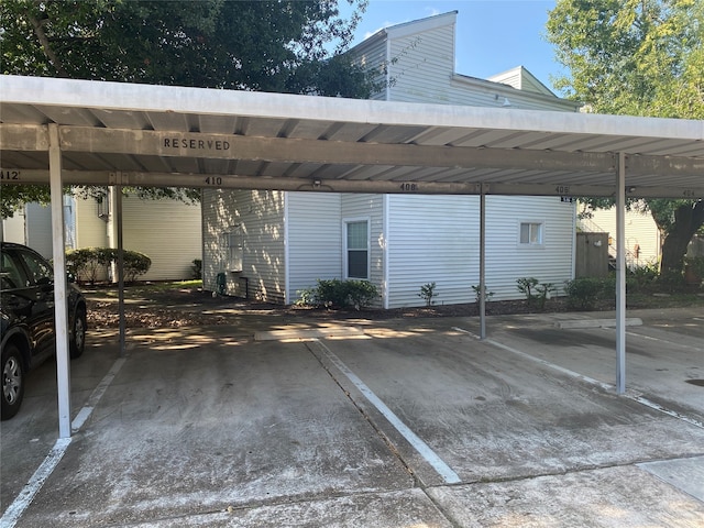 view of parking / parking lot with a carport