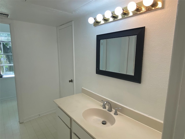 bathroom with vanity and tile patterned floors