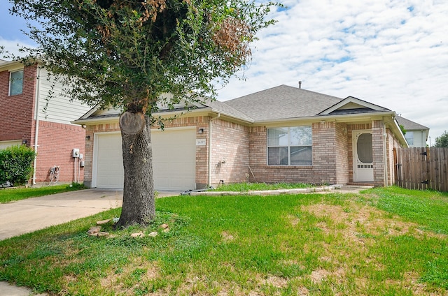 ranch-style house featuring a front yard and a garage