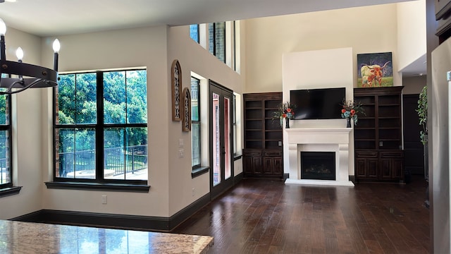 unfurnished living room featuring dark hardwood / wood-style flooring