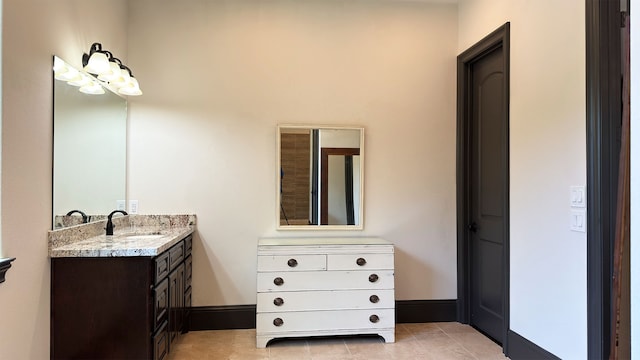 bathroom with tile patterned floors and vanity