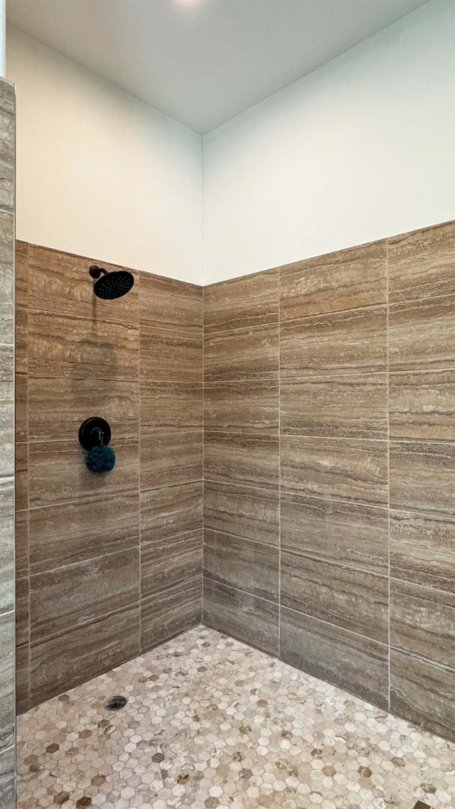 bathroom with tiled shower