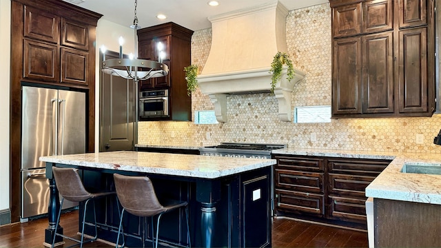 kitchen featuring appliances with stainless steel finishes, dark hardwood / wood-style flooring, custom exhaust hood, and backsplash