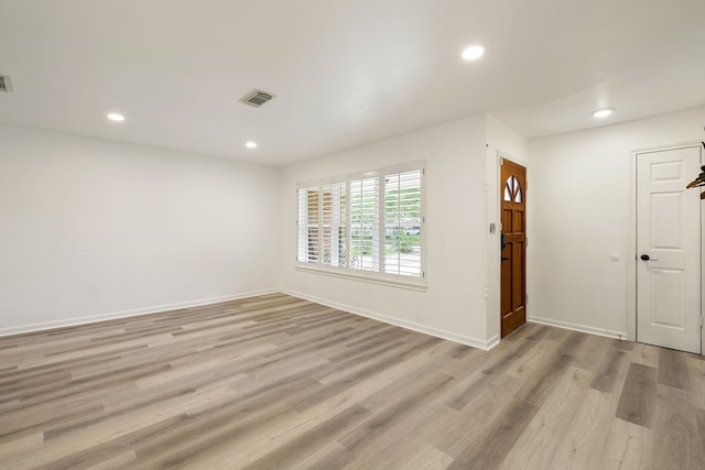 unfurnished room featuring light wood-type flooring