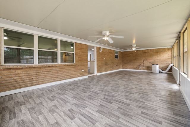 interior space with ceiling fan