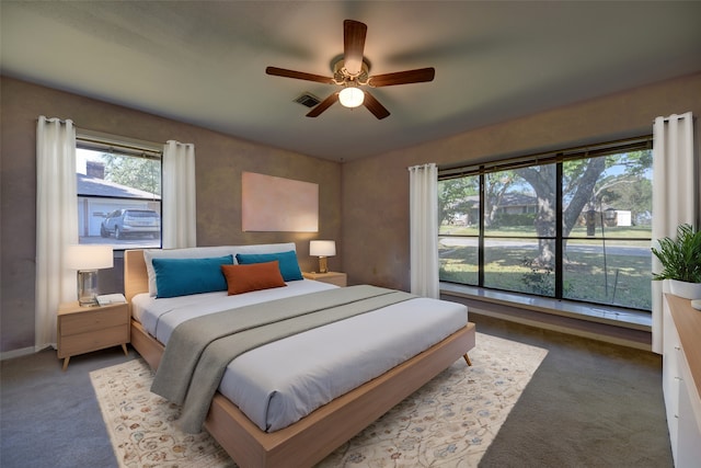 carpeted bedroom with ceiling fan