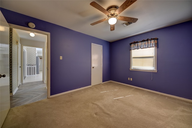 unfurnished bedroom featuring light parquet floors and ceiling fan