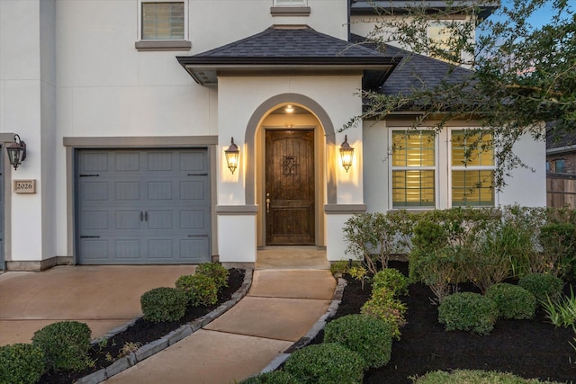 view of exterior entry featuring a garage