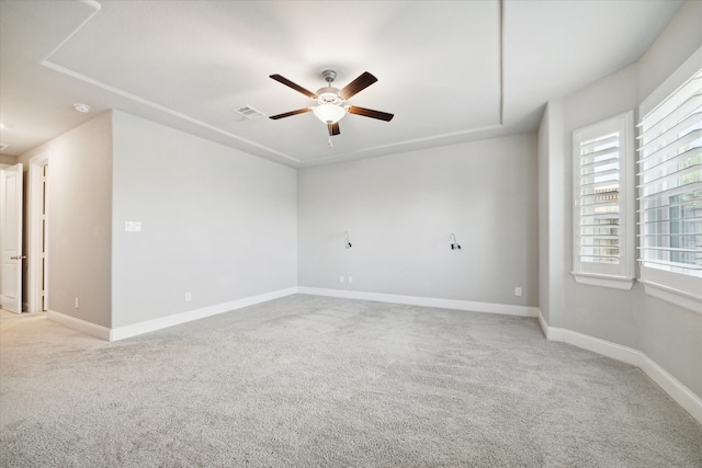 empty room with light carpet and ceiling fan