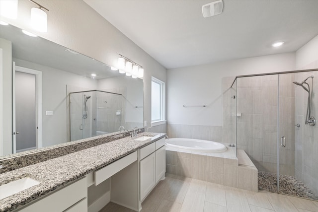 bathroom with vanity, tile patterned floors, and separate shower and tub