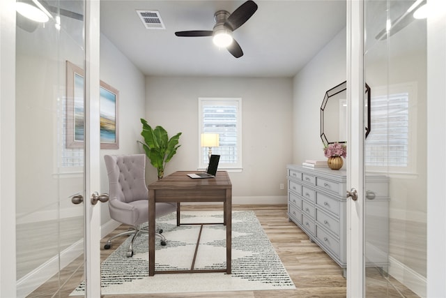 office featuring ceiling fan, french doors, and light hardwood / wood-style floors