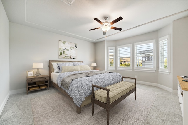 bedroom featuring light carpet and ceiling fan