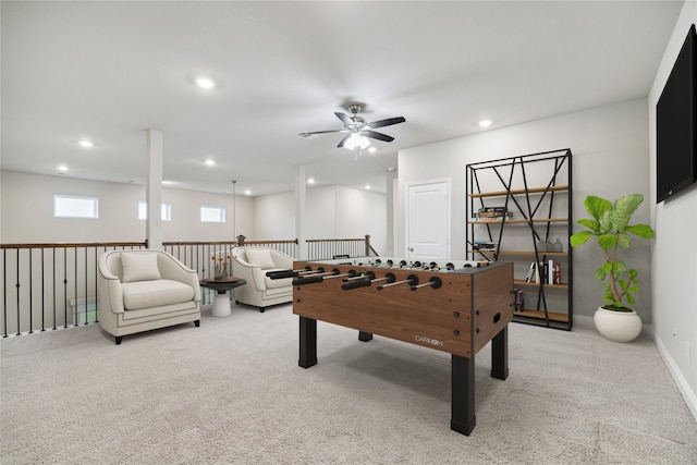 game room featuring ceiling fan and light colored carpet