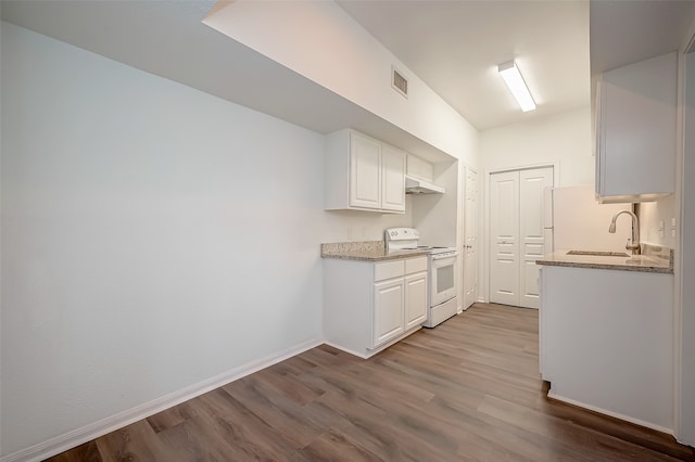 kitchen featuring light stone counters, light hardwood / wood-style floors, sink, electric stove, and white cabinetry