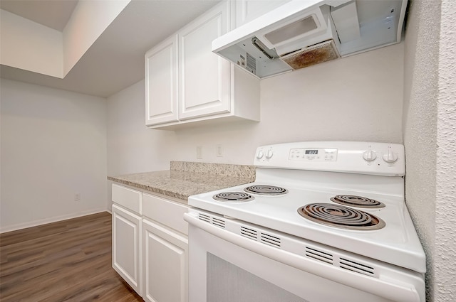 kitchen with white cabinets, exhaust hood, wood finished floors, baseboards, and electric range