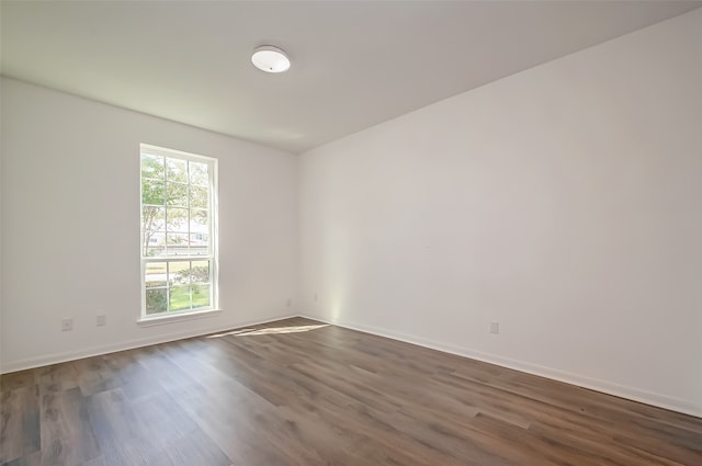 spare room featuring dark hardwood / wood-style flooring