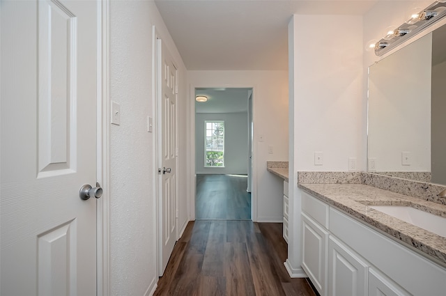 bathroom with vanity and hardwood / wood-style flooring